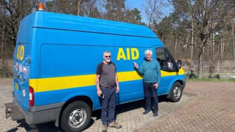 Harry Barnes, and Trevor Barrett with a large blue van. Harry Barnes, and Trevor Barrett with a large blue van.