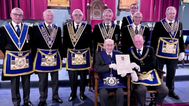 John H. Farrall and the rest of the lodge with his long service certificate John H. Farrall and the rest of the lodge with his long service certificate in full regalia.